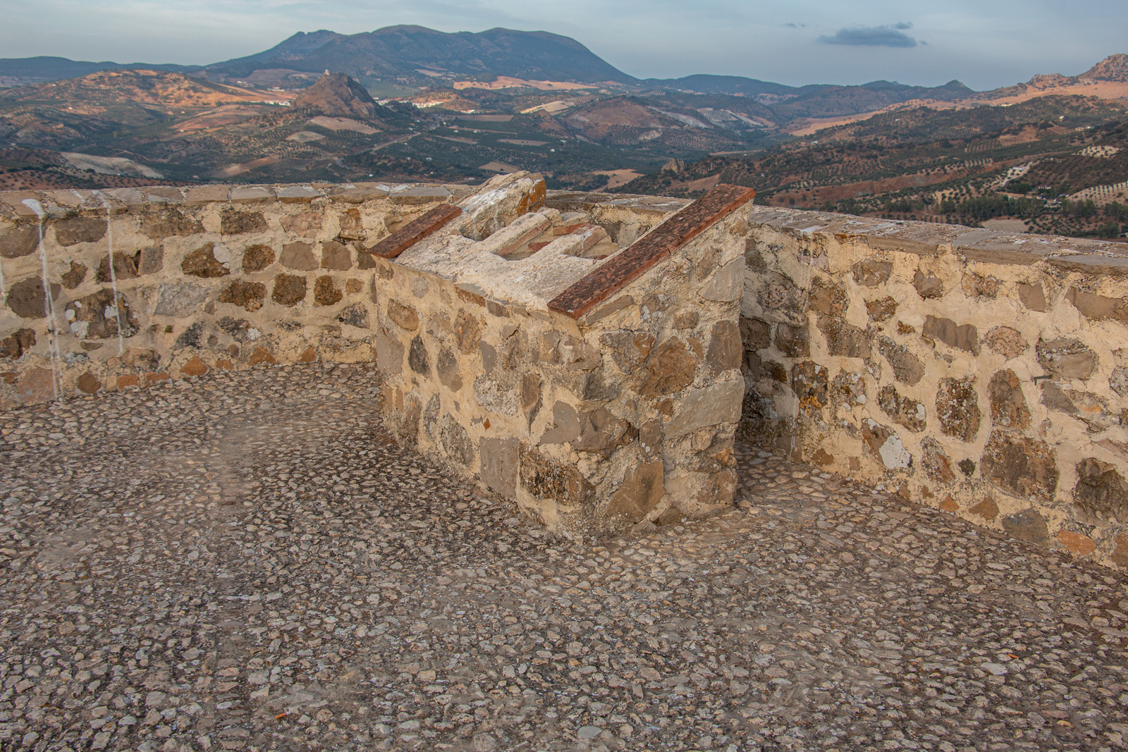 Chimney on the roof of the Tower of Homage.In the background, the castle of Pruna, in the province of Seville.